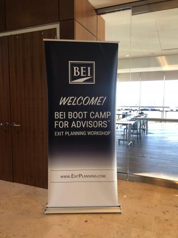 Blue BEI Boot Camp banner in front of conference room